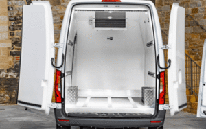 A modern freezer van delivering ice cream in UAE with frozen storage.