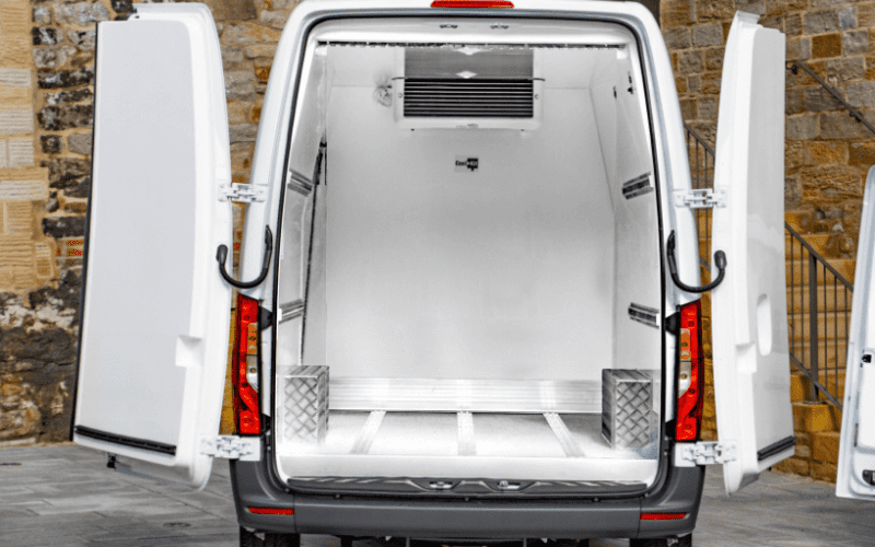A modern freezer van delivering ice cream in UAE with frozen storage.